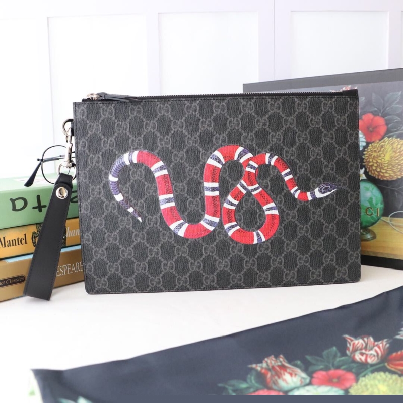 G*u*i clutch bags